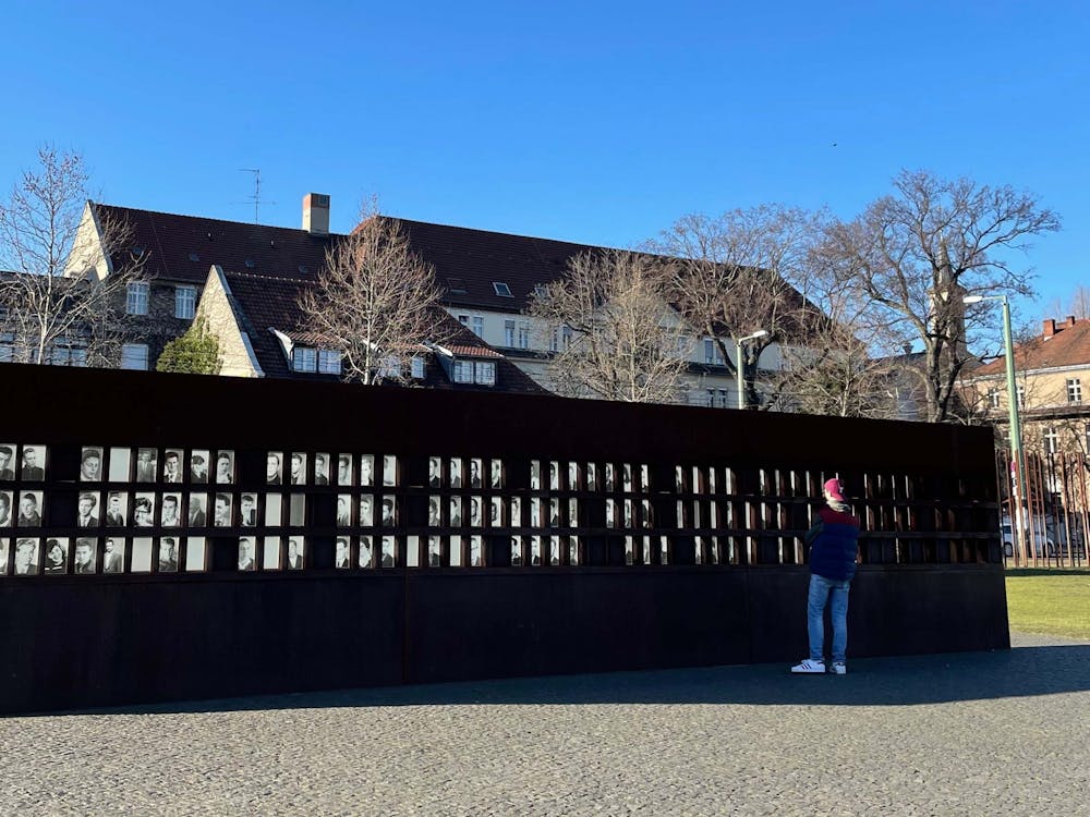 IDS columnist John Hultquist is pictured March 12, 2022,  in front  of the Berlin Wall Memorial in Berlin, Germany. The Berlin Wall Memorial pictures people who passed away trying to get over the wall to freedom. 