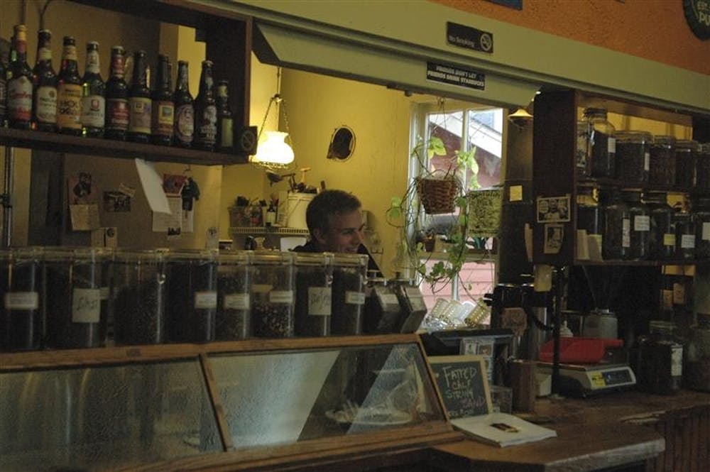 A waiter at the The Runicple Spoon serves customers from behind the counter. Located on 412 East 6th St., the restaurant has been a Bloomington staple since 1976. 
