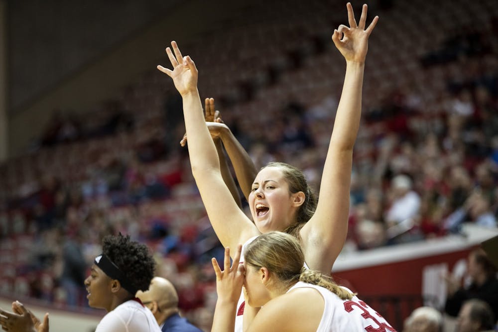 <p>Freshman Mackenzie Holmes celebrates after her teammate scored a 3-pointer Nov. 17 at Simon Skjodt Assembly Hall. IU will play the University of Miami on Dec. 4 in Coral Gables, Florida. </p>