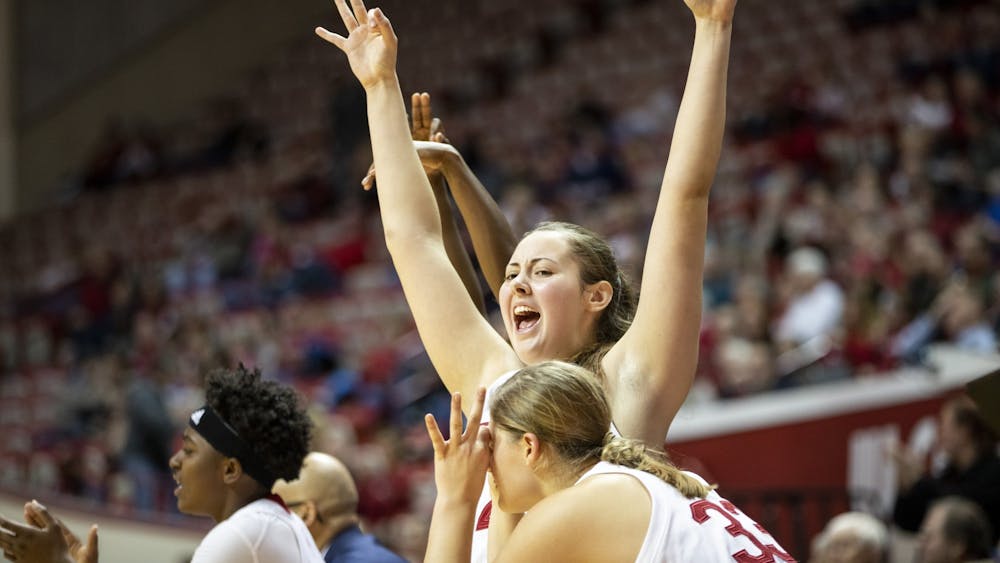 Freshman Mackenzie Holmes celebrates after her teammate scored a 3-pointer Nov. 17 at Simon Skjodt Assembly Hall. IU will play the University of Miami on Dec. 4 in Coral Gables, Florida. 