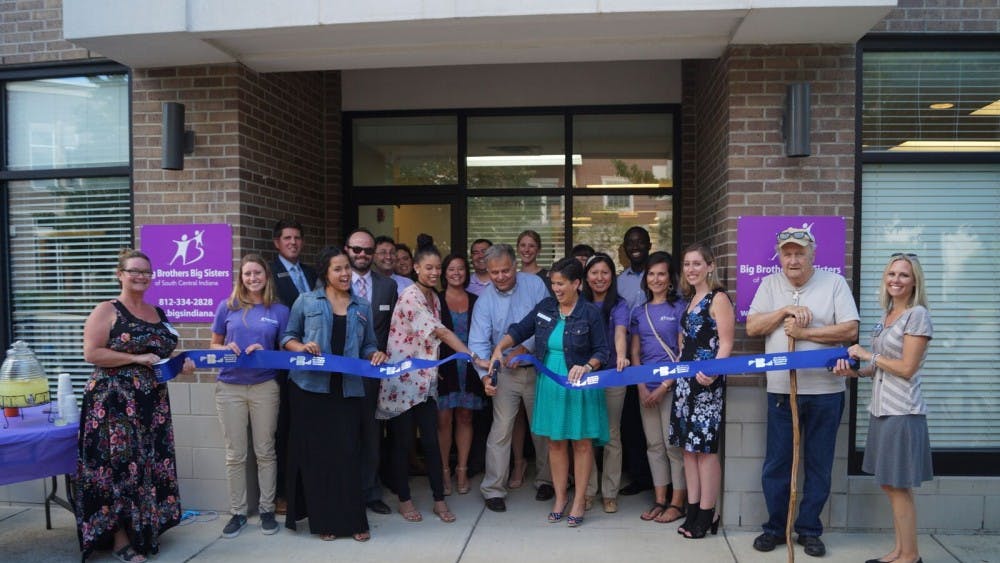 Executive Director Mark Voland cuts the ribbon at the open house for Big Brothers Big Sisters on Tuesday. Big Brothers Big Sisters recently relocated to 501 N Walnut St. (Courtesy Photo of BBBS)