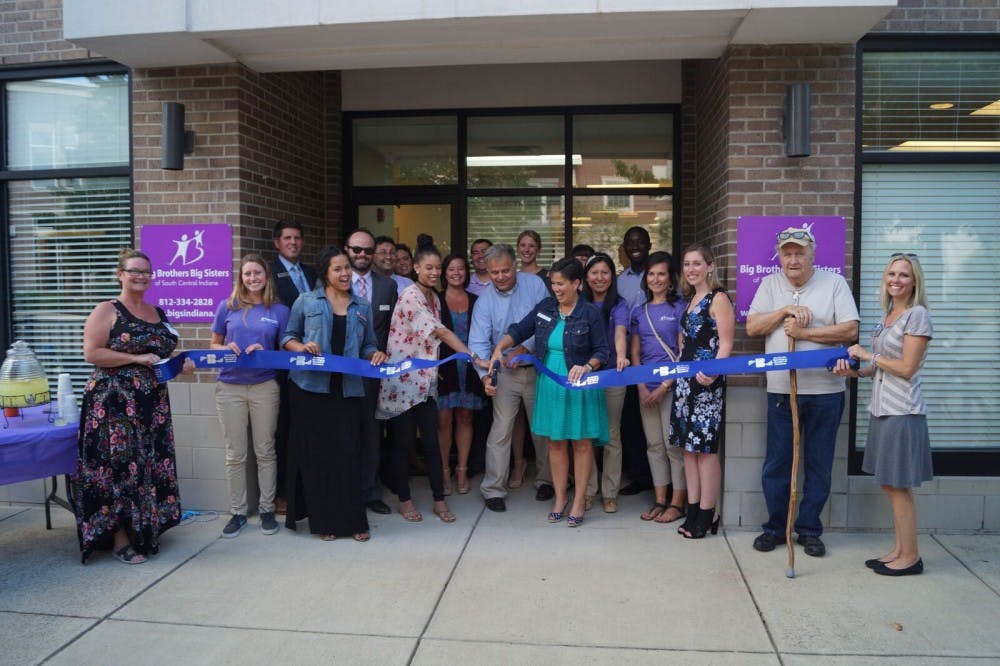 Executive Director Mark Voland cuts the ribbon at the open house for Big Brothers Big Sisters on Tuesday. Big Brothers Big Sisters recently relocated to 501 N Walnut St. (Courtesy Photo of BBBS)