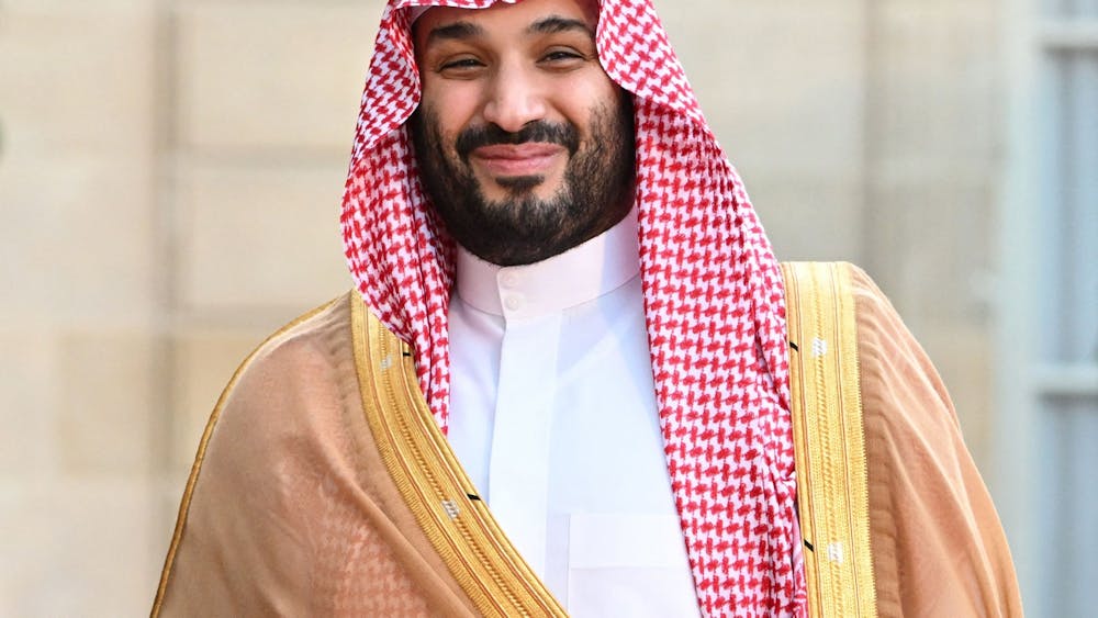 Saudi Crown Prince Mohammed bin Salman smiles as he arrives July 28, 2022, at the Elysee Palace in Paris for a meeting with French President Emmanuel Macron.