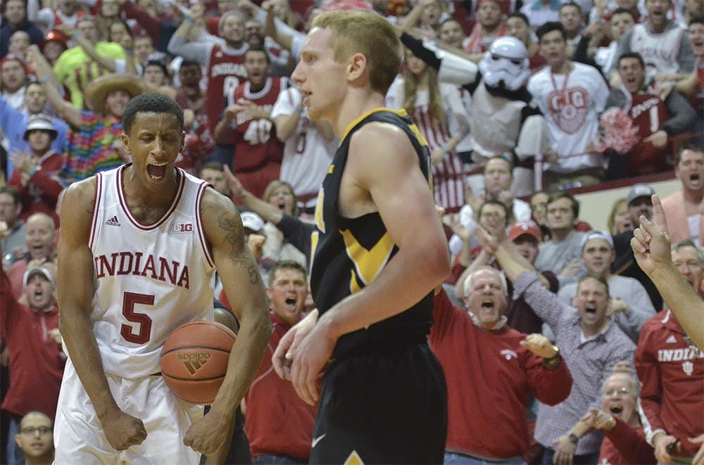 Junior guard Troy Williams celebrates after Iowa fouls his teammate Harrison Niego on Thursday at the Assembly Hall. The Hoosiers won 85-78. 