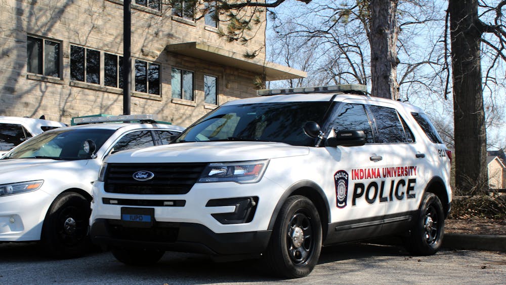 IUPD police cars sit at the IUPD station on March 5, 2023, on East 17th Street. IU settled a lawsuit in September involving the arrest of an IU graduate student after he did not pay a $3 parking fee.