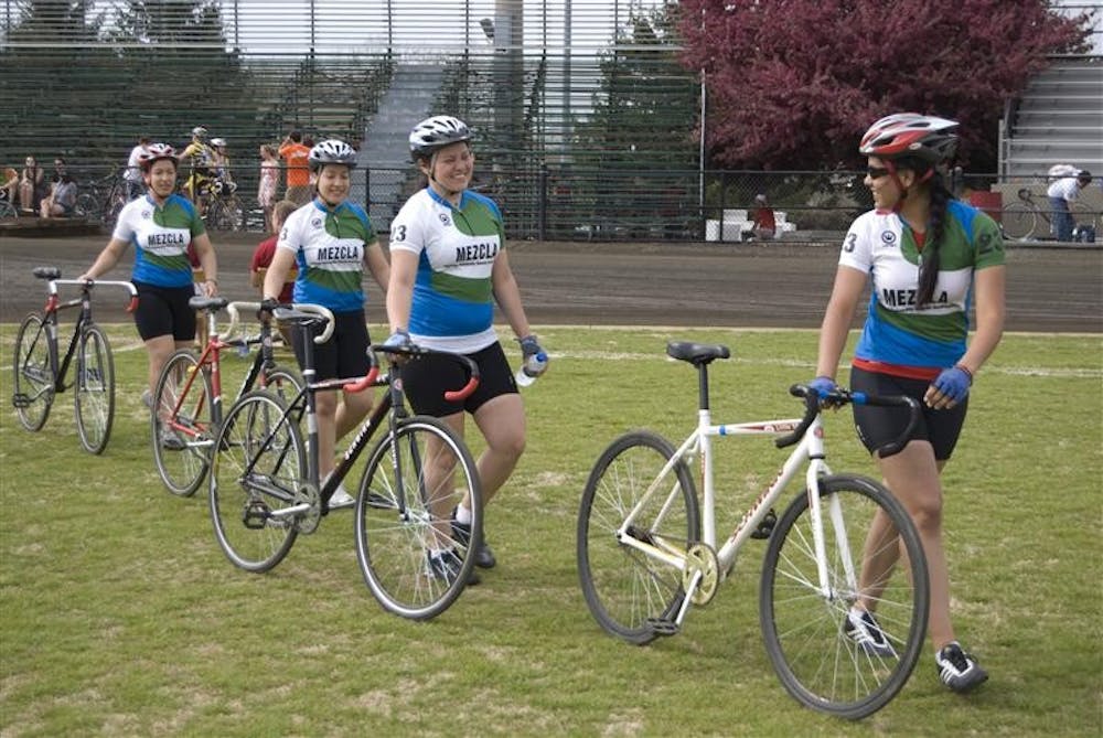 The Mezcla team walks toward final briefing before the sixth heat of Team Pursuit on April 18 at Bill Armstrong Stadium. The team consists of freshmen Tari and Cari Morales, senior Cristal Cabrera and freshman Sandra Salcido.