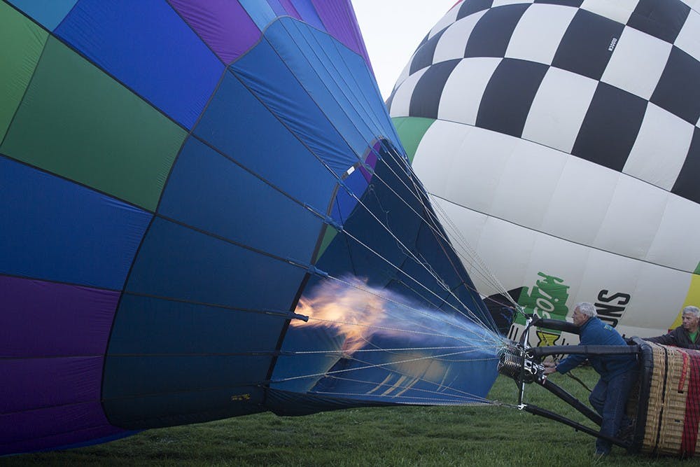 One of the Oliver Winery Balloons is blown up before its Sunday morning flight. Oliver Winery was the Up! Up! and Away Platinum sponsor for the festival.