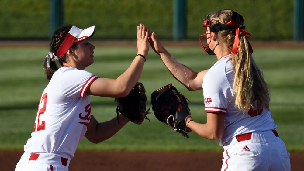 Then-sophomore utility Katie Lacefield and then-junior pitcher Tara Trainer high five during the 2018 season. IU won all five of its games during the Fau First Pitch Classic this weekend in Boca Raton, Florida.&nbsp;