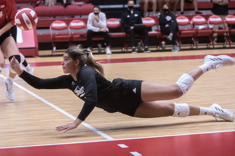 <p>Then-junior Paula Cerame dives for the ball during the IU volleyball’s Cream and. Crimson Scrimmage on Aug. 21, 2021, at Wilkinson Hall. The IU volleyball team held an intersquad match a week prior to the start of its season.</p>