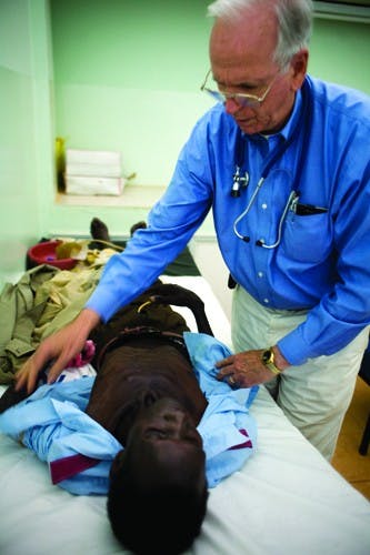Courtesy photoJoe Mamlin examins a patient at an HIV Clinic in Mosoriot, Kenya.