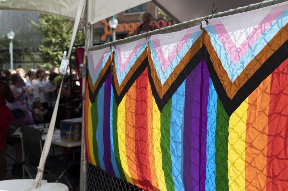 <p>Pride flags are attached to a fence at Pridefest on Aug. 27, 2022. The Monroe County Community School Corporation passed a resolution committed to helping LGBTQ students seek resources and support against bullying and harassment on March 28, 2023.</p>