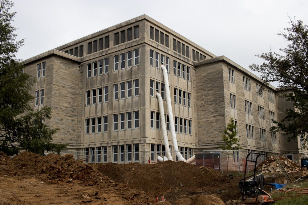 <p>Tubes flow out of dorm windows Aug. 21 in McNutt Quad. Due to McNutt Quad, Foster Quad and Teter Quad’s renovations, the buildings will be closed for the next year.</p>