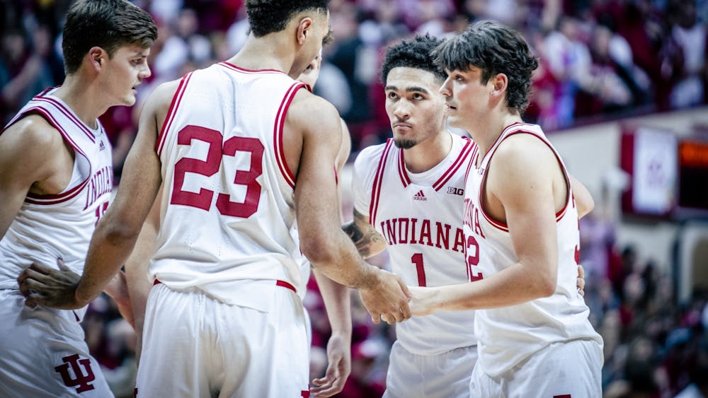Freshman guard Jalen Hood-Schifino is seen in a team huddle Jan. 28, 2023, at Simon Skjodt Assembly Hall in Bloomington. The Hoosiers beat Ohio State 86-70.