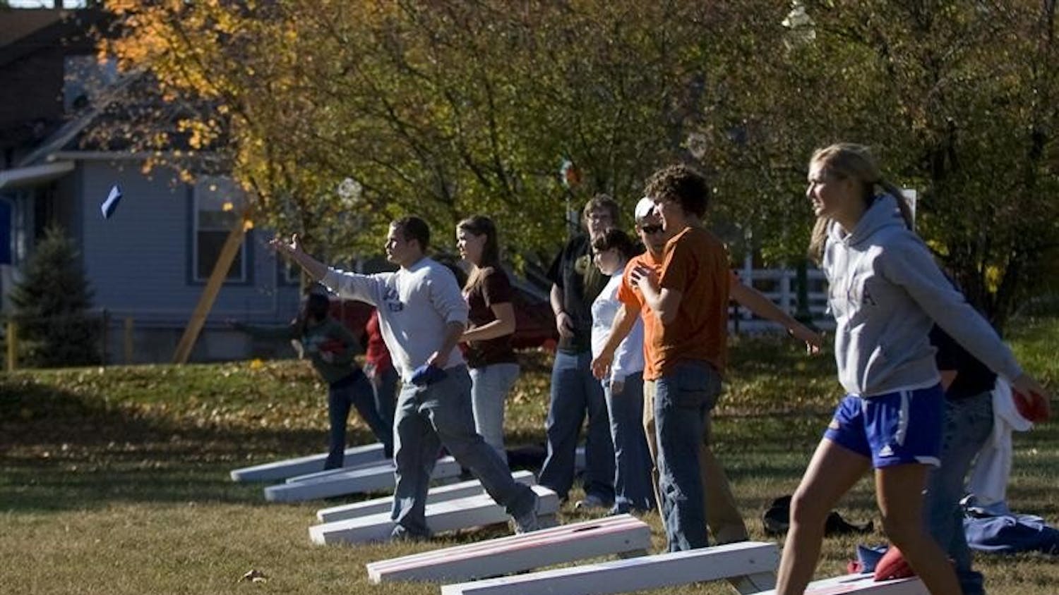 Players compete late Wednesday afternoon in a cornhole tournament at Dunn Meadow.  The event, hosted by the Student Alumni Association, will donate all proceeds to the United Way.