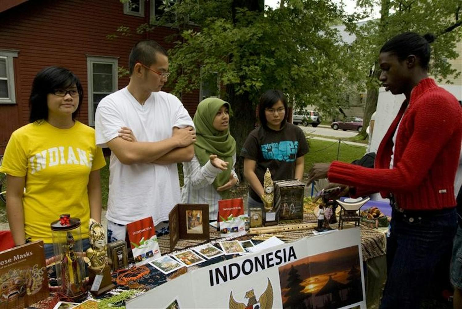 (left to right) Yoana Kurnadi, Anthony Tjandra, Sinta Nuryani and Cintya Hanasusanto promote the Indonesian Student Association (ISA) at the Asian Culture Center's opening event held Friday afternoon.