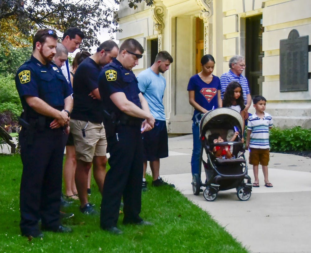 Bloomington residence stood silently outside of Bloomington courthouse to pray for the safety they have and be thankful to the officers on July 8th.
