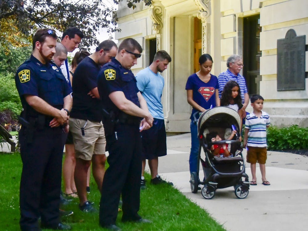 Bloomington residence stood silently outside of Bloomington courthouse to pray for the safety they have and be thankful to the officers on July 8th.