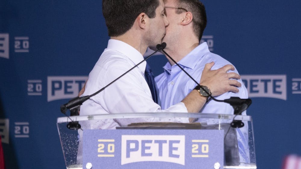 Pete Buttigieg, mayor of South Bend, Indiana, kisses his husband, Chasten, on April 14, 2019, in South Bend, Indiana. 