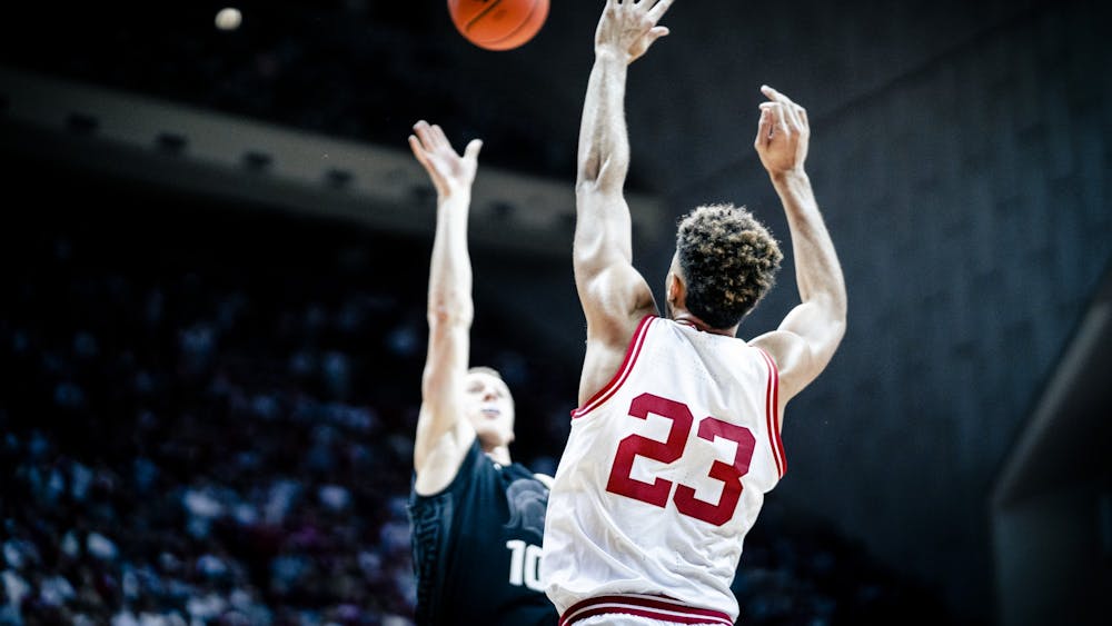Senior forward Trayce Jackson-Davis attempts to block a shot Jan. 22, 2023, at Simon Skjodt Assembly Hall in Bloomington. The Hoosiers beat Michigan State 69-82.