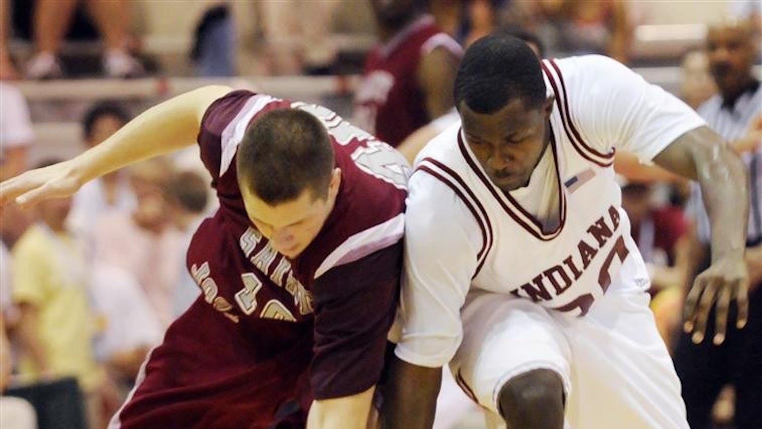 IU guard Nick Williams fights for a loose ball with Saint Joseph's Garrett Williamson during IU's 80-54 loss to Saint Joseph's in the second round of the EA SPORTS Maui Invitational on Tuesday in Lahaina, Hawaii. IU had 23 turnovers, leading to 34 points for Saint Joseph's.