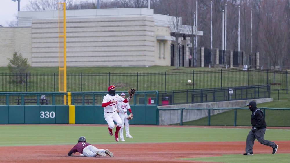 Senior plus Phillip Glasser jumps to caught the ball March 10, 2023, at Bart Kaufman Field. Indiana swept Bellarmine in a four-game series this weekend.