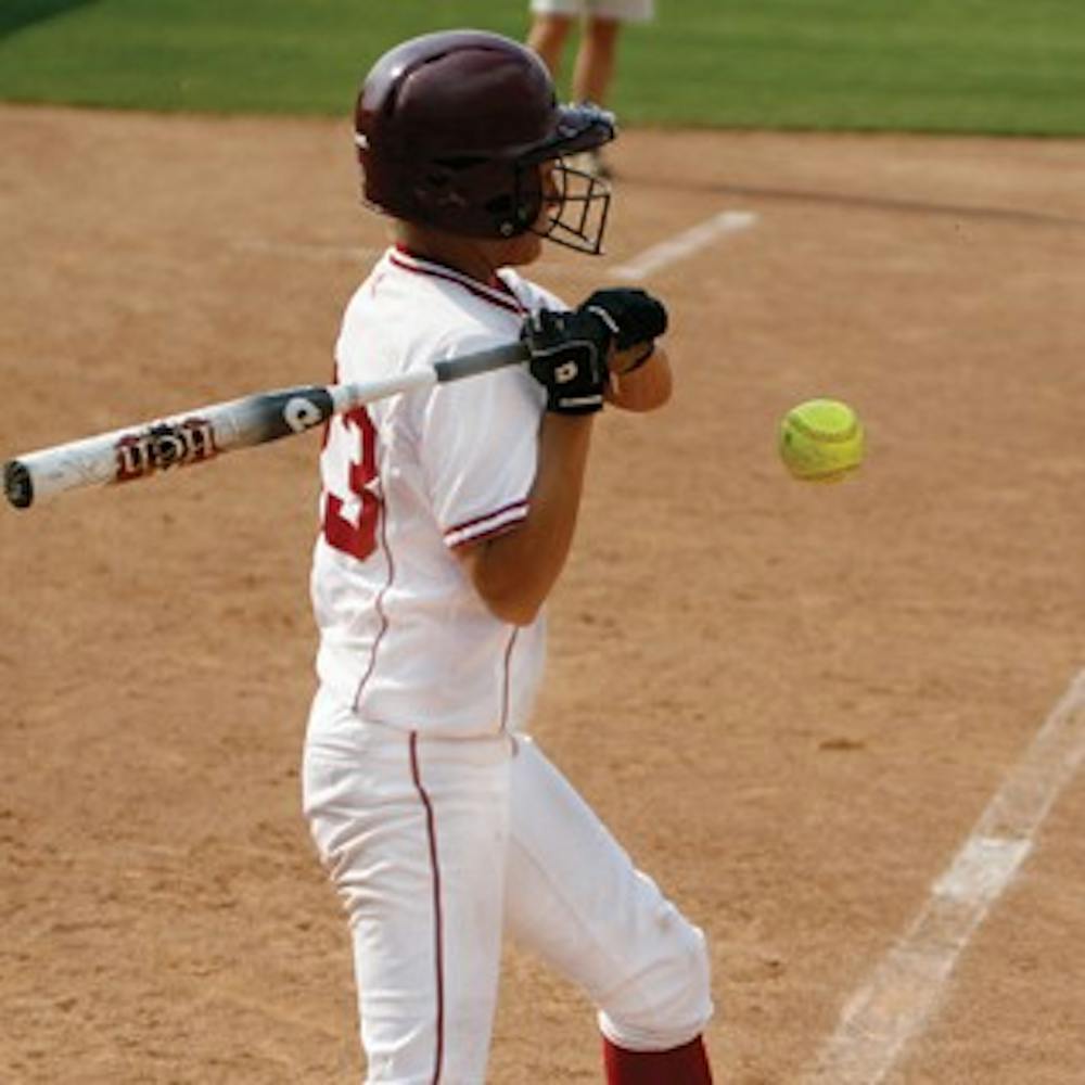 Brandon Foltz / IDS
IU junior utility Julie DiNallo takes an evasive swing against Louisville Wednesday afternoon at the IU Softball Fields.