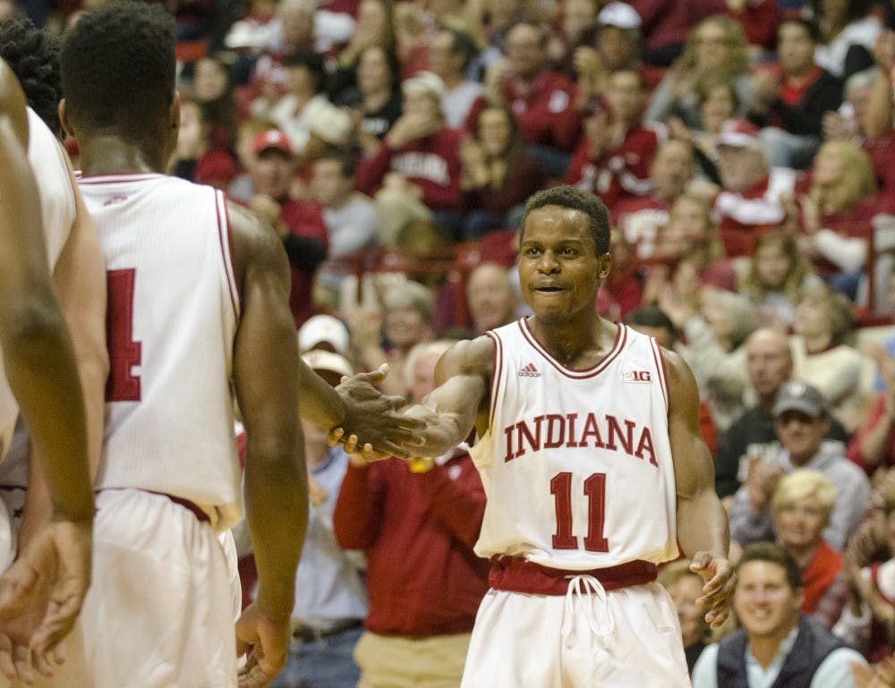 Senior guard Kevin “Yogi” Ferrell celebrates with his teammates after scoring during IU’s game against Eastern Illinois on Friday at Assembly Hall. The Hoosiers won 88-49.