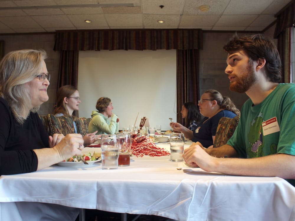 IU junior Dylan Haseman talks with one of his professors over lunch during the &quot;Take Your Professor to Lunch&quot; event Oct. 25, 2022. Haseman studies law and public policy at IU and was able to use this event to learn more about both from his professor. 