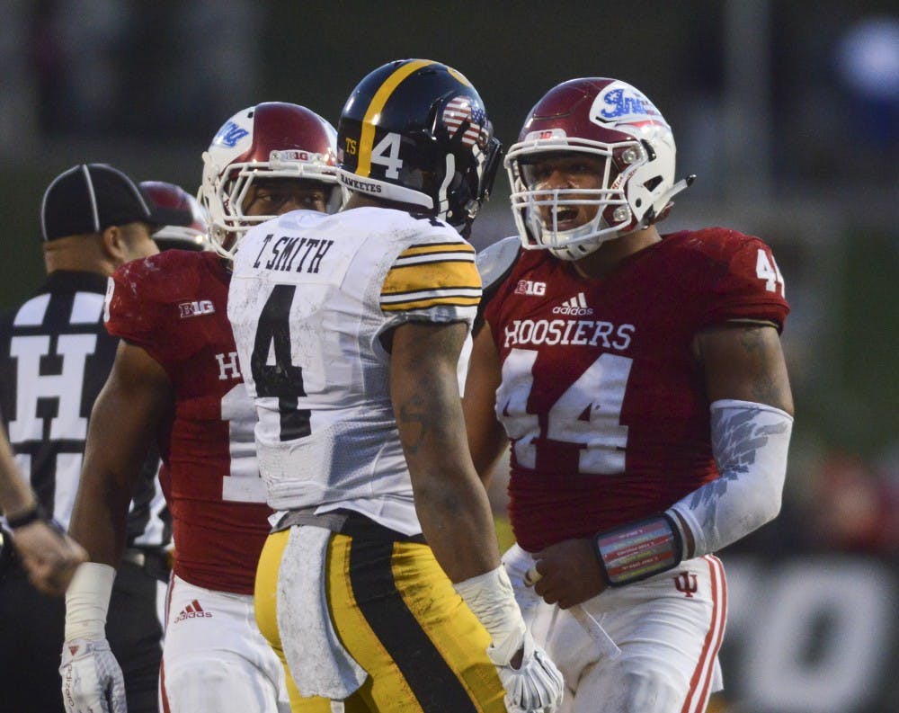 Linebacker Marcus Oliver (44) gets in an altercation with Iowa receiver Tevaun Smith (4) during the game against Iowa on Nov. 7, 2015 at Memorial Stadium. The Hoosiers lost, 27-35.