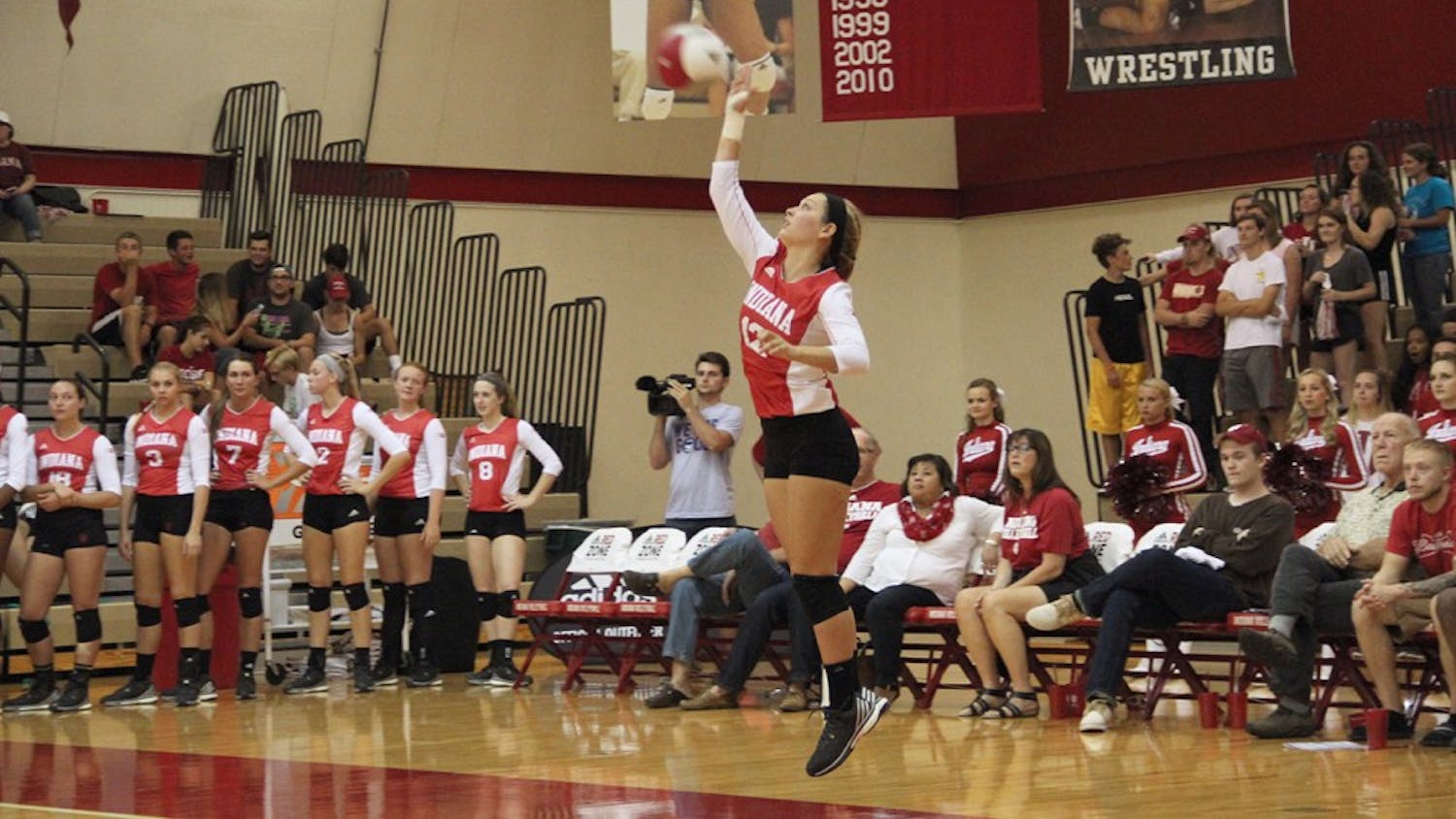 Samantha Fogg, Indiana University sophomore, serves the ball during volleyball competition against the Northwestern on Wednesday.