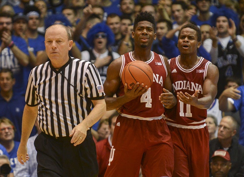 Sophomore guard Robert Johnson and senior guard Kevin "Yogi" Ferrell react to a techincal called on Johnson during the game against Duke on Wednesday at Cameron Indoor Stadium in Durham. The Hoosiers lost, 94-74.