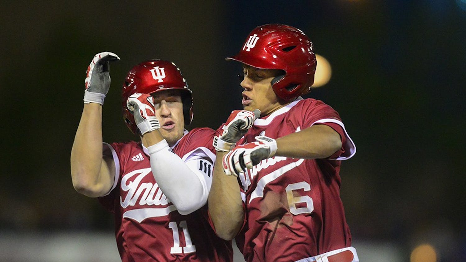 Senior Will Nolden celebrates with freshman Isaiah Pasteur after the Hoosiers beat Notre Dame on Tuesday at Victory Field in Indianapolis. Pasteur's hit allowed Nolden to score from second base, resulting in a walk-off.