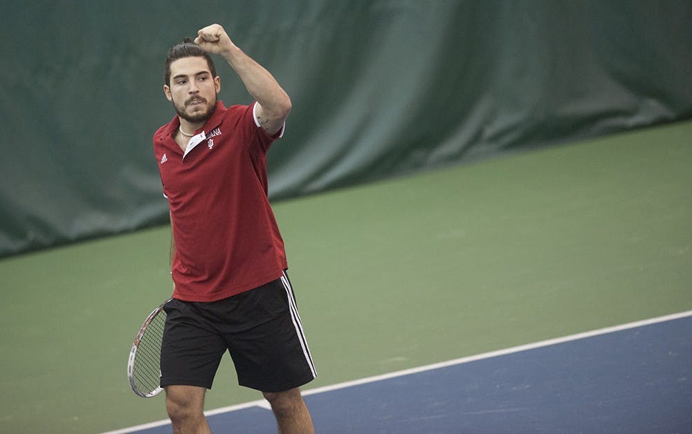 Sam Monnette celebrates after scoring a point against Kevin Farin of Oregon University on Friday at the IU Tennis Center. Monnette won the match 7-6 (7-4), 6-4.