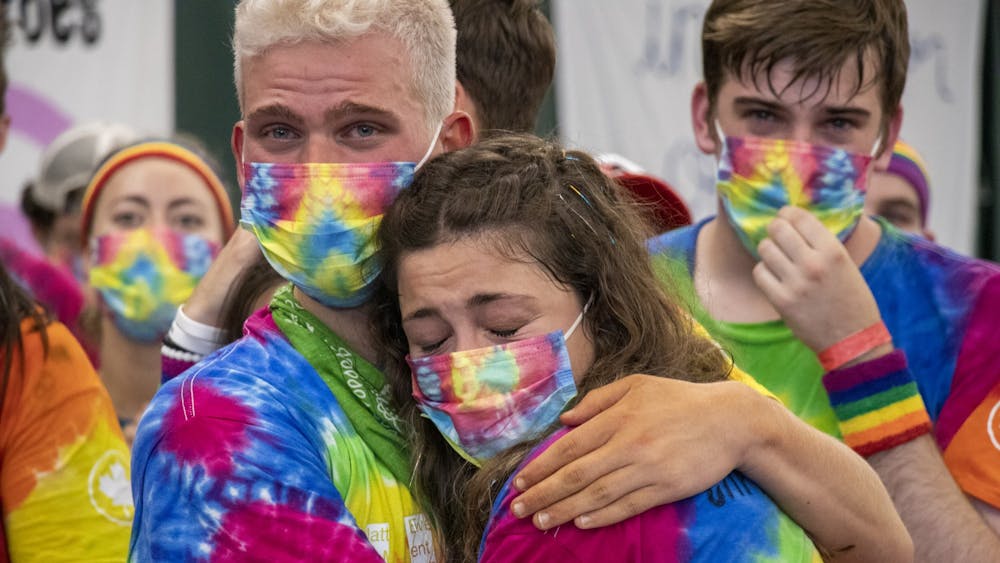 IU junior Jason Wendt hugs senior Erin Daly during the end of the IU Dance Marathon on Oct. 31, 2021, at the IU Tennis Center. Wendt and Daly had just finished line dancing on-stage as part of Team Morale.