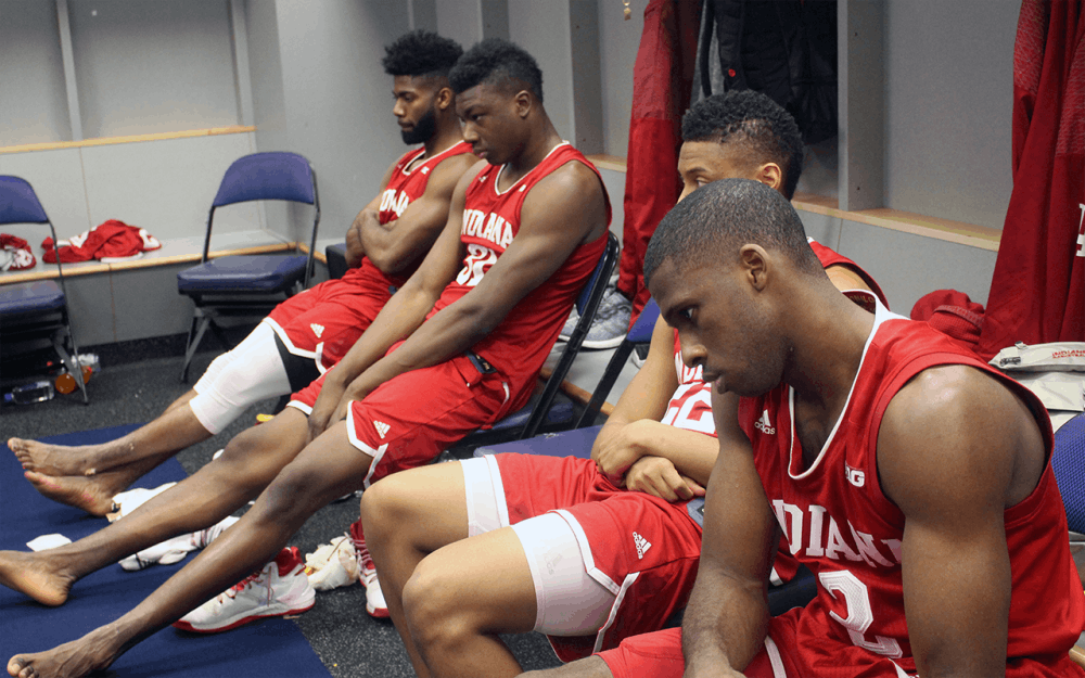 IU players sit quietly in the locker room after losing to Wisconsin in the Big Ten Tournament last week. The Hoosiers' season ended with a loss at the Georgia Tech Yellow Jackets on Tuesday in the NIT.