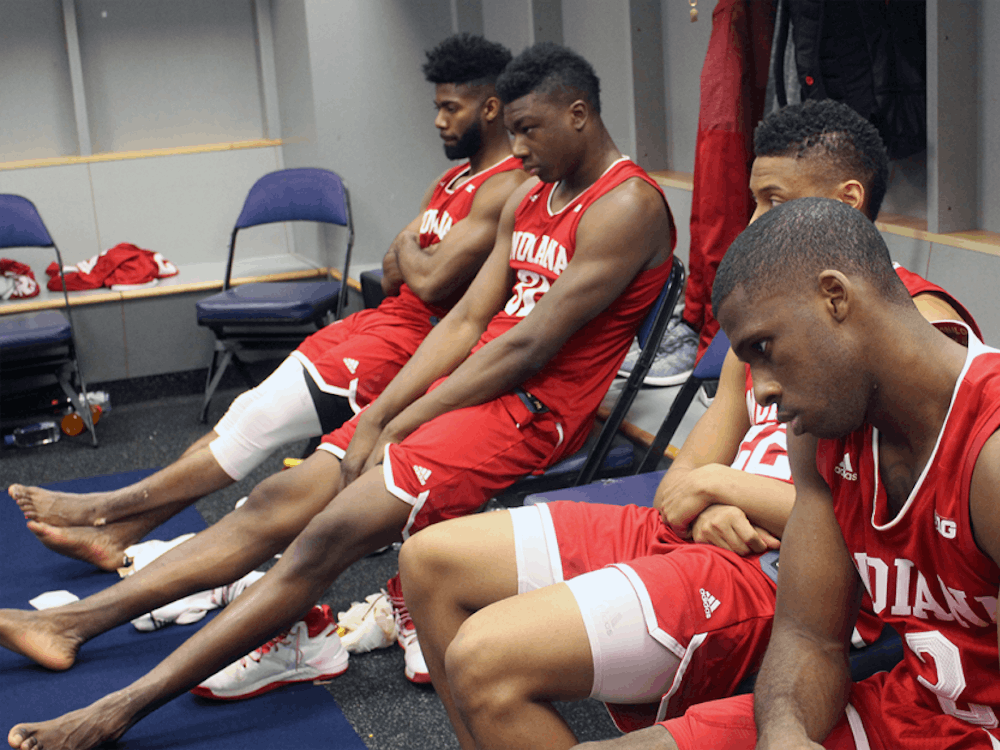 IU players sit quietly in the locker room after losing to Wisconsin in the Big Ten Tournament last week. The Hoosiers' season ended with a loss at the Georgia Tech Yellow Jackets on Tuesday in the NIT.