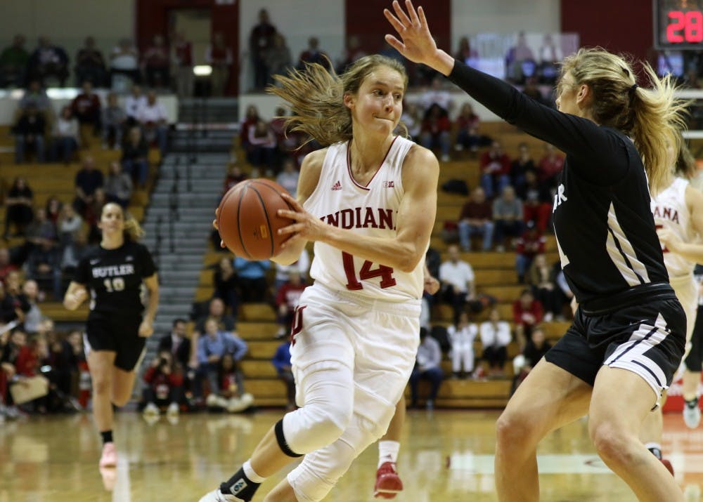 <p>Junior forward Ali Patberg dribbles in the lane toward the basket against a Butler defender Dec. 5 at Simon Skjodt Assembly Hall. Patberg scored sixteen points as the Hoosiers defeated the Bulldogs, 66-46.</p>