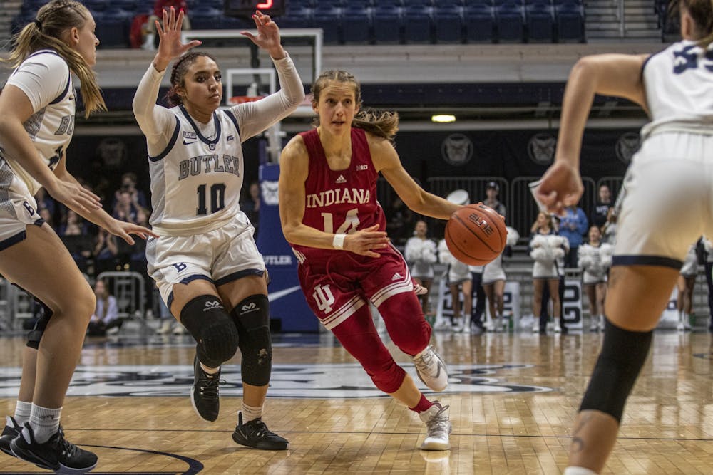 <p>IU graduate student Ali Patberg dribbles through the Butler defense during the game against Butler University on Nov. 10, 2021, at Hinkle Fieldhouse. Wednesday&#x27;s game against Michigan State has been postponed until further notice. </p>