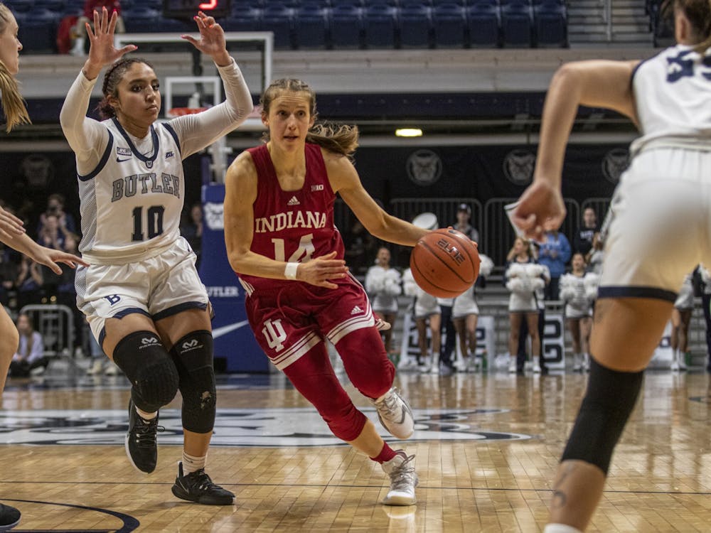 IU graduate student Ali Patberg dribbles through the Butler defense during the game against Butler University on Nov. 10, 2021, at Hinkle Fieldhouse. Wednesday&#x27;s game against Michigan State has been postponed until further notice. 