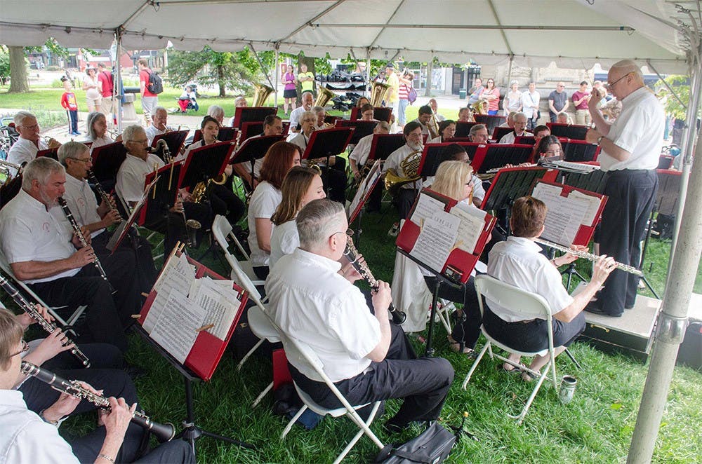 Bloomington Community Band perform at the July Fourth Pre-Parade Concert at the south side of the Bloomington Courthouse Square. The concert featured patriotic music, American classics, and favorite marches.