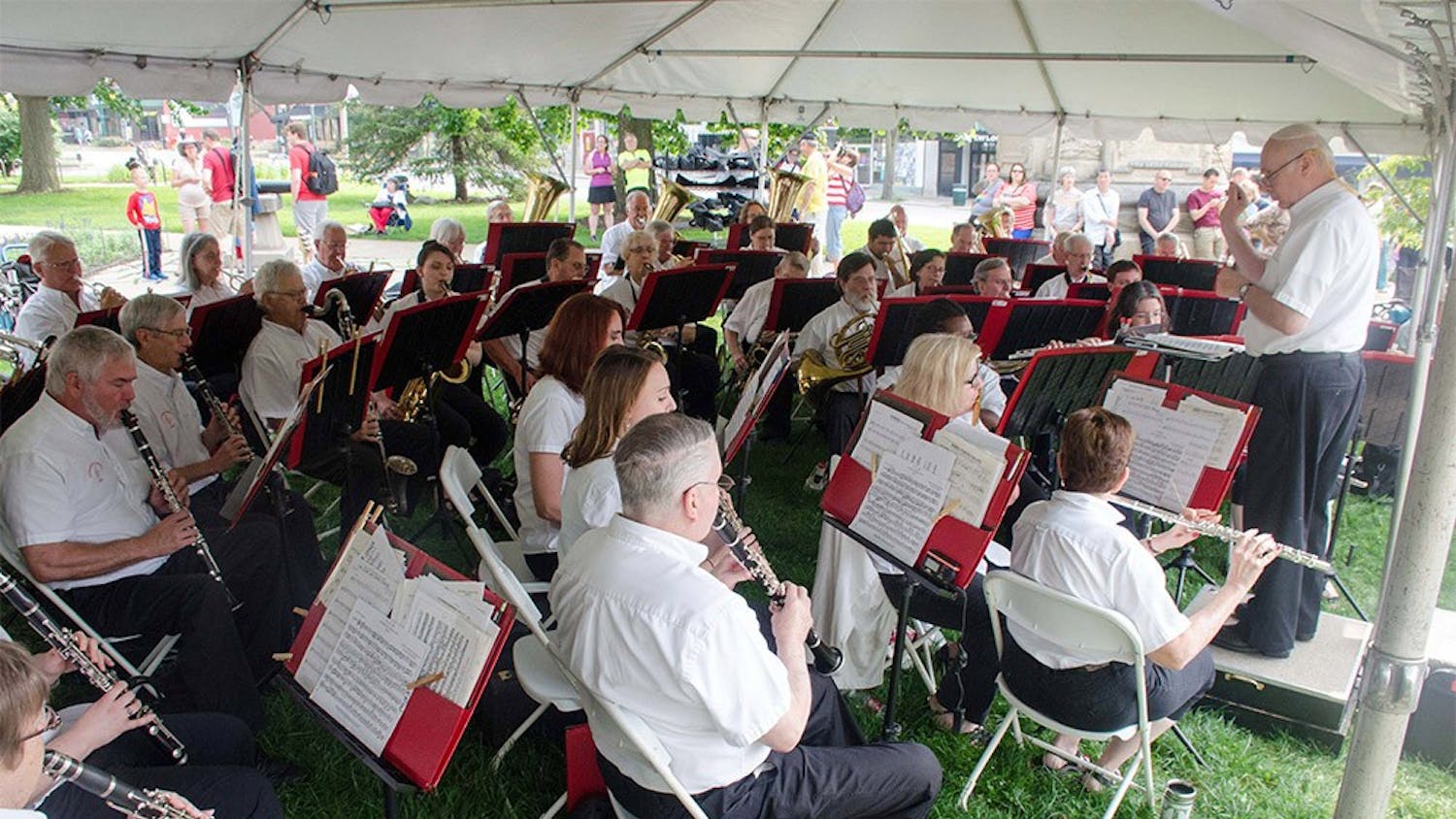 Bloomington Community Band perform at the July Fourth Pre-Parade Concert at the south side of the Bloomington Courthouse Square. The concert featured patriotic music, American classics, and favorite marches.