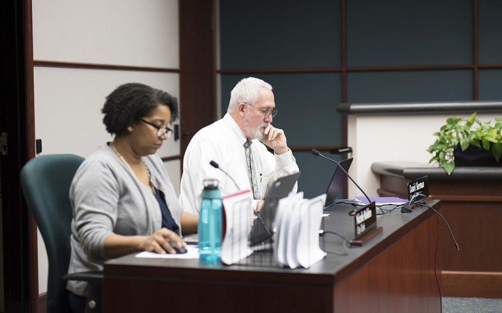 Daniel Sherman, coucil attorney, and Nicole Bolden, city clerk, prepare for the first city council meeting of the year. The meeting took place in the coucil chambers at City Hall Wednesday night.