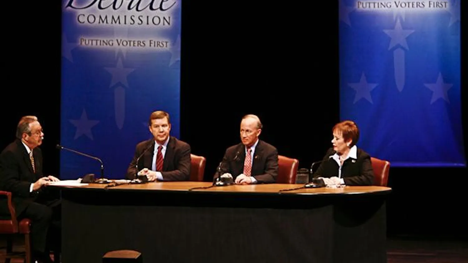 Moderator Tom Cochrun, and gubernatorial candidates Andy Horning, Mitch Daniels and Jill Long Thompson talk Tuesday evening at the IU Auditorium.
