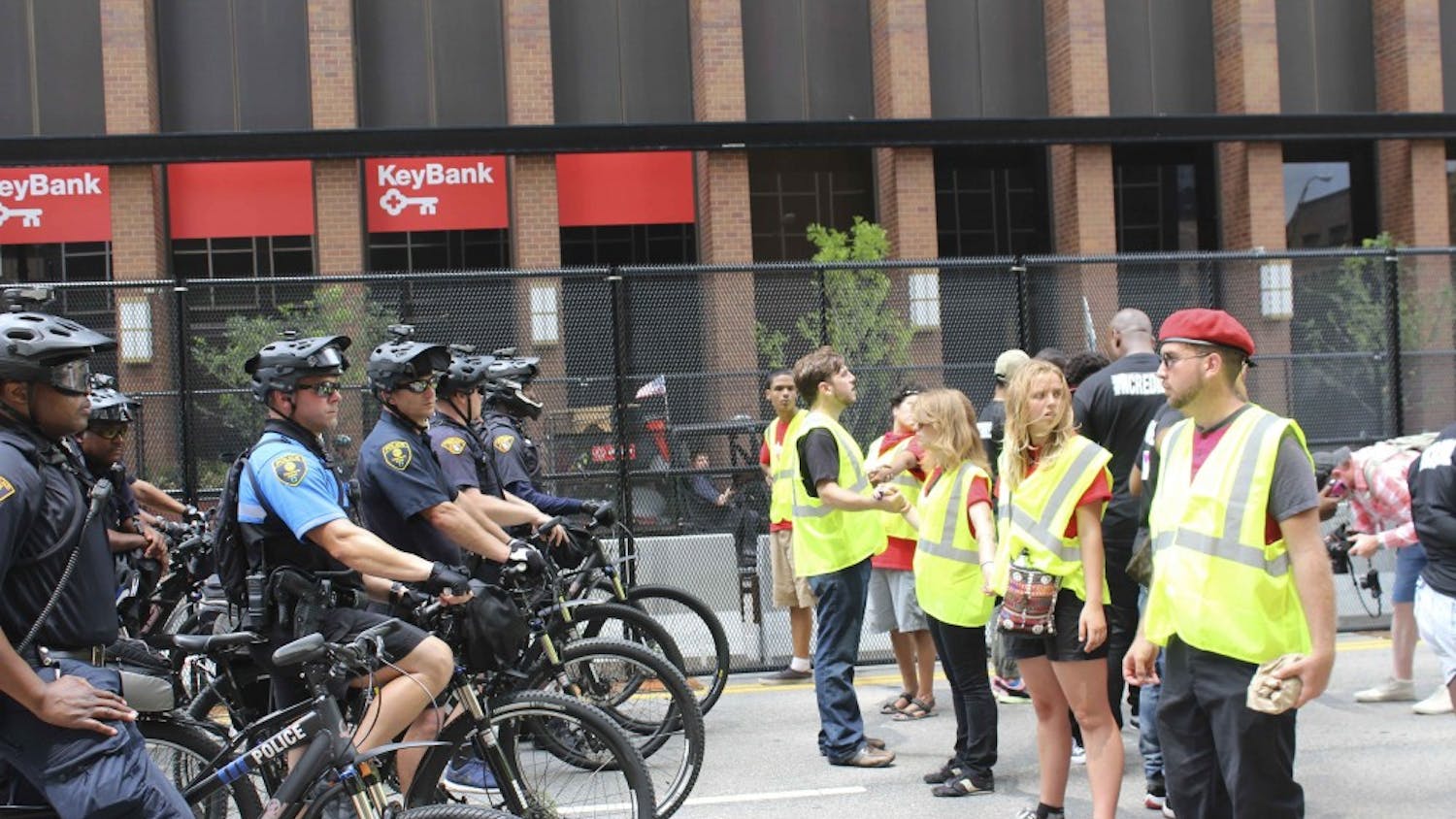 police and Dump Trump protesters.