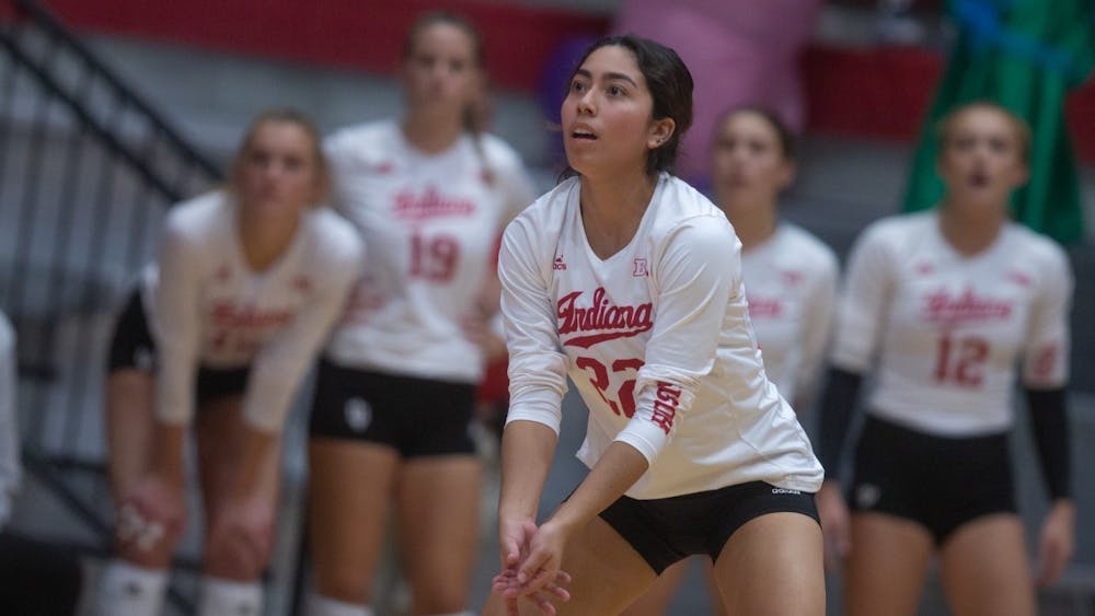 Then-junior defensive specialist Isa Lopez prepares to bump the ball during a volleyball game against Rutgers on Oct. 28, 2022. Indiana went 0-3 in the Long Beach Invitational.