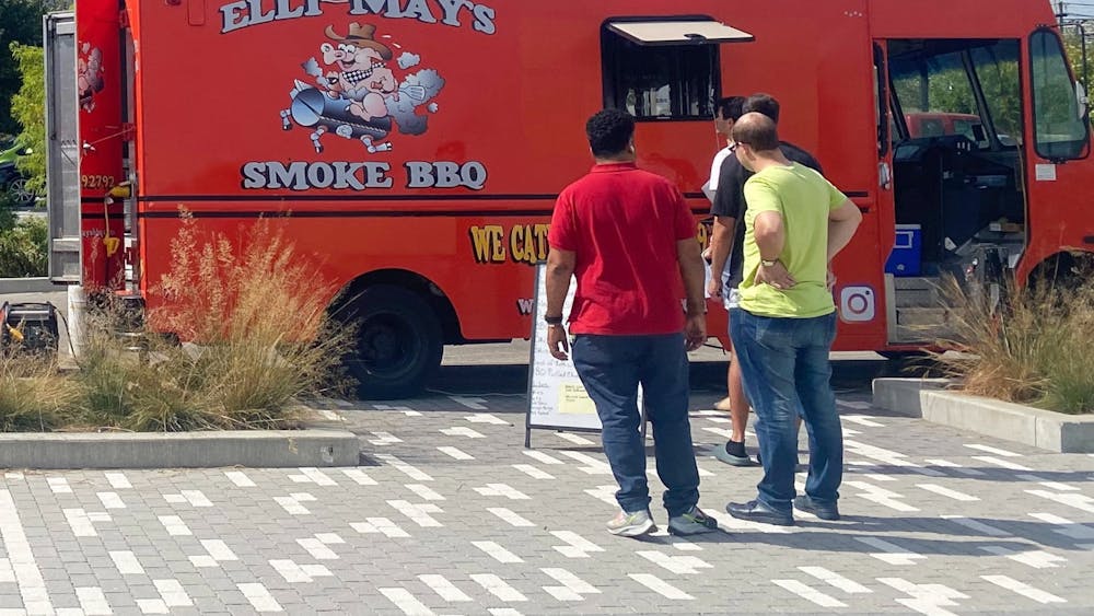 People are pictured waiting for Elli-May&#x27;s brisket on Sept. 22, 2023, at Switchyard Park. The food truck offers a variety of barbeque options with all locally sourced ingredients.