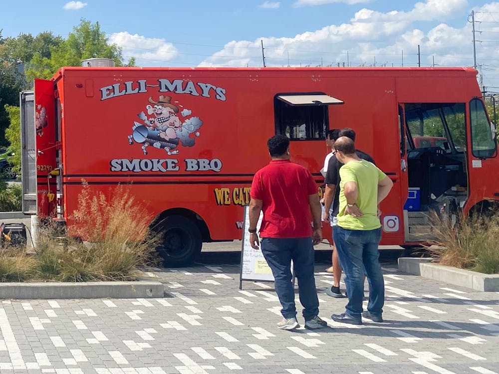People are pictured waiting for Elli-May&#x27;s brisket on Sept. 22, 2023, at Switchyard Park. The food truck offers a variety of barbeque options with all locally sourced ingredients.