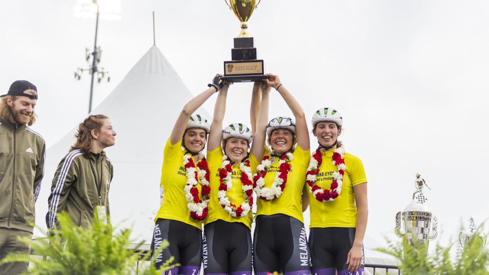 Seniors Abby Green, Grace Washburn, Luren Etnyre and freshman Nora Abdelkader of Melanzana Cycling hold up the 35th women&#x27;s Little 500 Trophy April 21, 2023. Melanzana received first place followed by Teter in second.