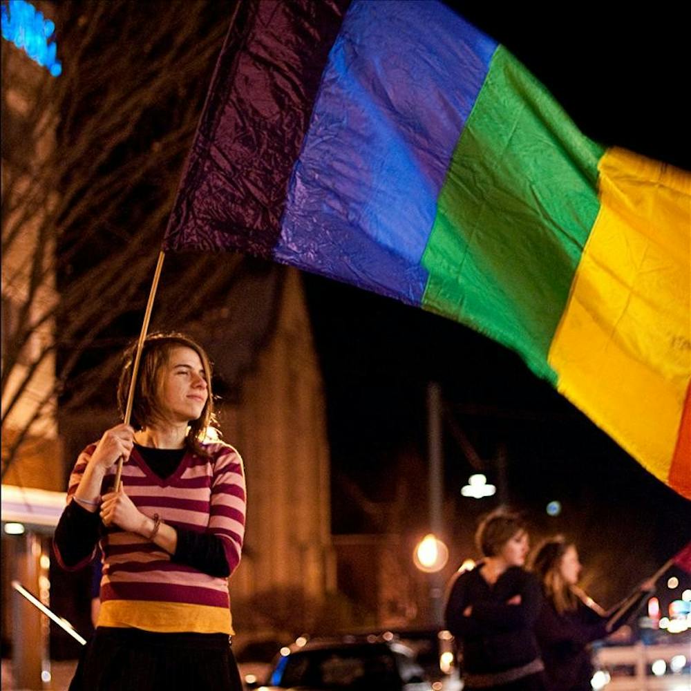 A member of the Bleeding Heartland Rollergirls outside the Buskirk-Chumley Theater during the Pride Film Festival Saturday evening.