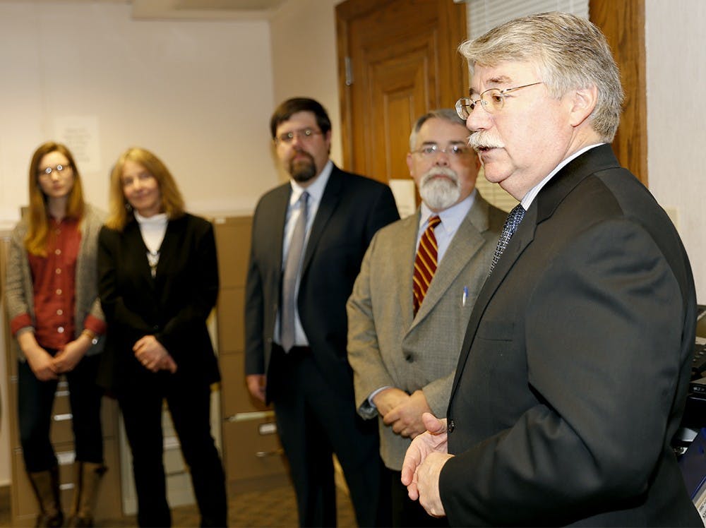 Indiana Attorney General Greg Zoeller, left, speaks to members of Indiana Legal Services, Inc. Thursday at the Indiana Legal Services, Inc. building. 